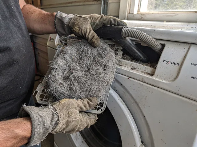 Cleaning Dryer Lint Trap in Kannapolis